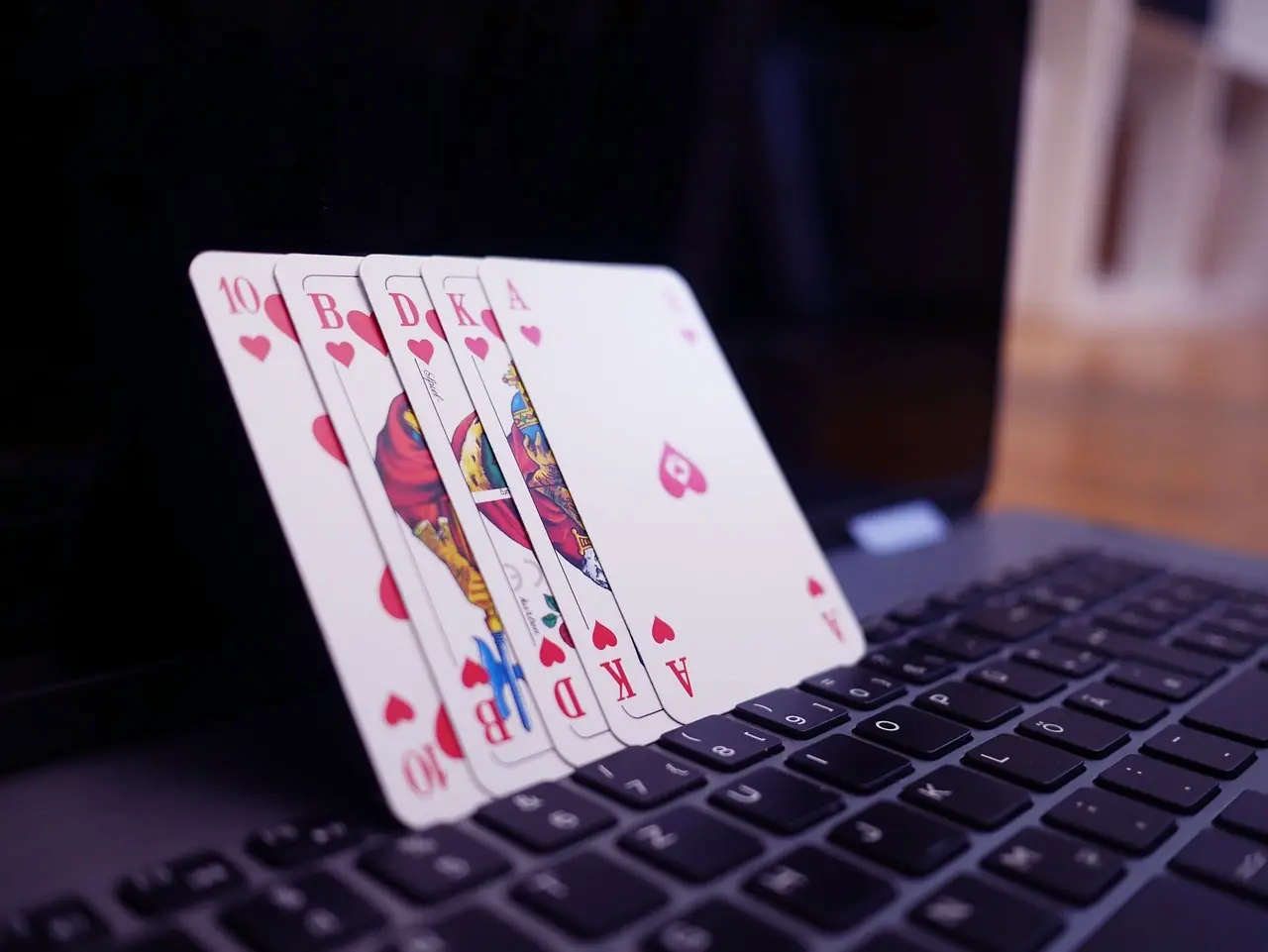 Playing cards on laptop keyboard